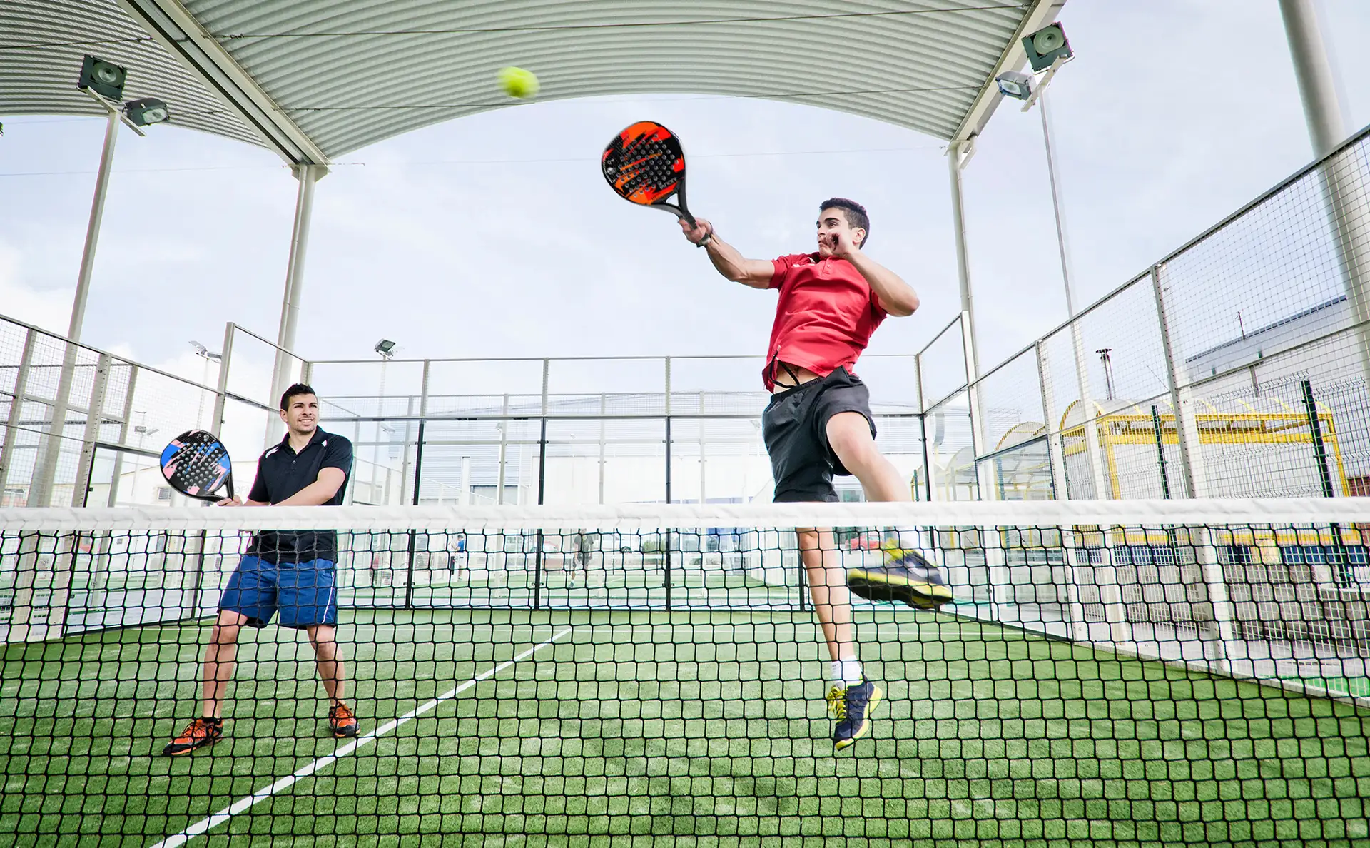 Padel player hitting a volley with an IANONI racket